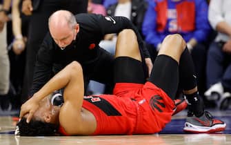 PHILADELPHIA, PENNSYLVANIA - APRIL 16: Scottie Barnes #4 of the Toronto Raptors receives medical attention during the fourth quarter against the Philadelphia 76ers during Game One of the Eastern Conference First Round at Wells Fargo Center on April 16, 2022 in Philadelphia, Pennsylvania. NOTE TO USER: User expressly acknowledges and agrees that, by downloading and or using this photograph, User is consenting to the terms and conditions of the Getty Images License Agreement. (Photo by Tim Nwachukwu/Getty Images)