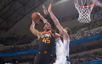 DALLAS, TX - APRIL 18: Donovan Mitchell #45 of the Utah Jazz dunks the ball during the game against the Dallas Mavericks during Round 1 Game 2 of the NBA Playoffs on April 18, 2022 at the American Airlines Center in Dallas, Texas. NOTE TO USER: User expressly acknowledges and agrees that, by downloading and or using this photograph, User is consenting to the terms and conditions of the Getty Images License Agreement. Mandatory Copyright Notice: Copyright 2022 NBAE (Photo by Glenn James/NBAE via Getty Images)