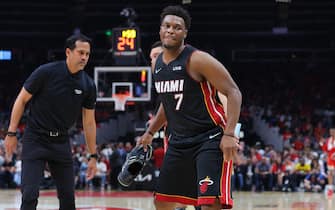ATLANTA, GEORGIA - APRIL 22: Kyle Lowry #7 of the Miami Heat is helped off the court after losing his shoe against the Atlanta Hawks during the third quarter in Game Three of the Eastern Conference First Round at State Farm Arena on April 22, 2022 in Atlanta, Georgia. NOTE TO USER: User expressly acknowledges and agrees that, by downloading and or using this photograph, User is consenting to the terms and conditions of the Getty Images License Agreement.  (Photo by Kevin C. Cox/Getty Images)
