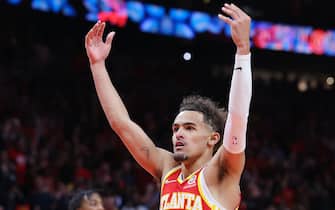 ATLANTA, GEORGIA - APRIL 22: Trae Young #11 of the Atlanta Hawks celebrates after making a floater with 5.5 seconds remaining during the fourth quarter against the Miami Heat in Game Three of the Eastern Conference First Round at State Farm Arena on April 22, 2022 in Atlanta, Georgia. NOTE TO USER: User expressly acknowledges and agrees that, by downloading and or using this photograph, User is consenting to the terms and conditions of the Getty Images License Agreement.  (Photo by Kevin C. Cox/Getty Images)
