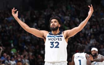 MINNEAPOLIS, MN -  APRIL 23: Karl-Anthony Towns #32 of the Minnesota Timberwolves cheers during Round 1 Game 4 of the 2022 NBA Playoffs on April 23, 2022 at Target Center in Minneapolis, Minnesota. NOTE TO USER: User expressly acknowledges and agrees that, by downloading and or using this Photograph, user is consenting to the terms and conditions of the Getty Images License Agreement. Mandatory Copyright Notice: Copyright 2022 NBAE (Photo by Joe Murphy/NBAE via Getty Images)