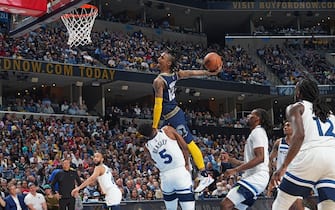 MEMPHIS, TN - APRIL 26: Ja Morant #12 of the Memphis Grizzlies dunks the ball against the Minnesota Timberwolves during Round 1 Game 5 on April 26, 2022 at FedExForum in Memphis, Tennessee. NOTE TO USER: User expressly acknowledges and agrees that, by downloading and/or using this Photograph, user is consenting to the terms and conditions of the Getty Images License Agreement. Mandatory Copyright Notice: Copyright 2022 NBAE (Photo by Jesse D. Garrabrant/NBAE via Getty Images)