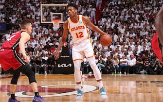 MIAMI, FL - APRIL 26: De'Andre Hunter #12 of the Atlanta Hawks dribbles the ball during the game against the Miami Heat during Round 1 Game 5 of the 2022 NBA Playoffs on April 26, 2022 at FTX Arena in Miami, Florida. NOTE TO USER: User expressly acknowledges and agrees that, by downloading and or using this Photograph, user is consenting to the terms and conditions of the Getty Images License Agreement. Mandatory Copyright Notice: Copyright 2022 NBAE (Photo by Issac Baldizon/NBAE via Getty Images)
