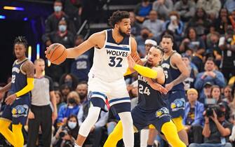 MEMPHIS, TN - APRIL 26: Karl-Anthony Towns #32 of the Minnesota Timberwolves handles the ball against the Memphis Grizzlies during Round 1 Game 5 on April 26, 2022 at FedExForum in Memphis, Tennessee. NOTE TO USER: User expressly acknowledges and agrees that, by downloading and/or using this Photograph, user is consenting to the terms and conditions of the Getty Images License Agreement. Mandatory Copyright Notice: Copyright 2022 NBAE (Photo by Jesse D. Garrabrant/NBAE via Getty Images)