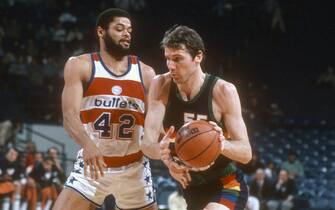 LANDOVER, MD - CIRCA 1982:  Kiki VanDeWeghe #55 of the Denver Nuggets drives on Greg Ballard #42 of the Washington Bullets during an NBA basketball game circa 1982 at the Capital Centre in Landover, Maryland. VanDeWeghe played for the Nuggets from 1980-84. (Photo by Focus on Sport/Getty Images) *** Local Caption *** Kiki VanDeWeghe; Greg Ballard
