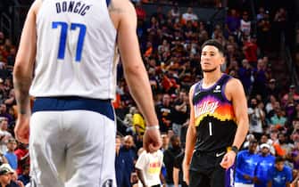 PHOENIX, AZ - MAY 4: Devin Booker #1 of the Phoenix Suns looks on against the Dallas Mavericks during Game 2 of the 2022 NBA Playoffs Western Conference Semifinals on May 4, 2022 at Footprint Center in Phoenix, Arizona. NOTE TO USER: User expressly acknowledges and agrees that, by downloading and or using this photograph, user is consenting to the terms and conditions of the Getty Images License Agreement. Mandatory Copyright Notice: Copyright 2022 NBAE (Photo by Barry Gossage/NBAE via Getty Images)