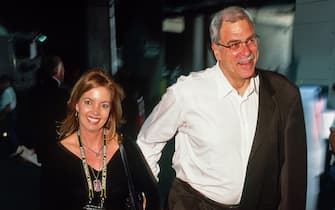 LOS ANGELES - JUNE 6: Los Angeles Lakers Head Coach Phil Jackson and Jeanie Buss arrive during Game One of the 2001 NBA Finals on June 6, 2001 at Staples Center in Los Angeles, California. NOTE TO USER: User expressly acknowledges and agrees that, by downloading and or using this photograph, User is consenting to the terms and conditions of the Getty Images License Agreement. Mandatory Copyright Notice: Copyright 2001 NBAE (Photo by Andy Hayt/NBAE via Getty Images)