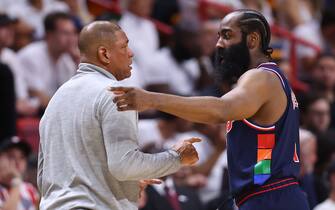 MIAMI, FLORIDA - MAY 10: James Harden #1 of the Philadelphia 76ers talks with head coach Doc Rivers against the Miami Heat during the first half in Game Five of the Eastern Conference Semifinals at FTX Arena on May 10, 2022 in Miami, Florida. NOTE TO USER: User expressly acknowledges and agrees that, by downloading and or using this photograph, User is consenting to the terms and conditions of the Getty Images License Agreement.  (Photo by Michael Reaves/Getty Images)