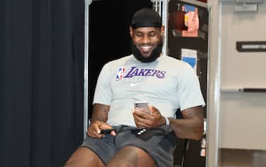 ORLANDO, FL - OCTOBER 6: LeBron James #23 of the Los Angeles Lakers talks on FaceTime after Game Four of the NBA Finals on October 6, 2020 at AdventHealth Arena in Orlando, Florida. NOTE TO USER: User expressly acknowledges and agrees that, by downloading and/or using this Photograph, user is consenting to the terms and conditions of the Getty Images License Agreement. Mandatory Copyright Notice: Copyright 2020 NBAE (Photo by Nathaniel S. Butler/NBAE via Getty Images)