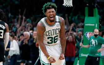 Boston - May 15: The Celtics Marcus Smart reacts after he hit a fourth quarter three pointer to extend the large Boston lead. The Boston Celtics host the Milwaukee Bucks in Game 7 of the Eastern Conference semi-finals between the Celtics and Bucks on May 15, 2022 at TD Garden in Boston. (Photo by Jim Davis/The Boston Globe via Getty Images)
