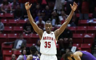 SAN DIEGO, CALIFORNIA - MARCH 20: Christian Koloko #35 of the Arizona Wildcats celebrates defeating the TCU Horned Frogs 85-80 during overtime in the second round game of the 2022 NCAA Men's Basketball Tournament at Viejas Arena at San Diego State University on March 20, 2022 in San Diego, California. (Photo by Sean M. Haffey/Getty Images)