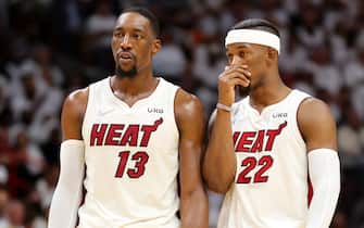 MIAMI, FLORIDA - MAY 19: Bam Adebayo #13 and Jimmy Butler #22 of the Miami Heat talk during the second quarter against the Boston Celtics in Game Two of the 2022 NBA Playoffs Eastern Conference Finals at FTX Arena on May 19, 2022 in Miami, Florida. NOTE TO USER: User expressly acknowledges and agrees that, by downloading and or using this photograph, User is consenting to the terms and conditions of the Getty Images License Agreement. (Photo by Michael Reaves/Getty Images)