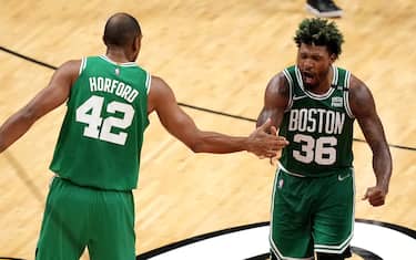MIAMI, FLORIDA - MAY 19: Marcus Smart #36 of the Boston Celtics celebrates a three point basket with teammate Al Horford #42 during the fourth quarter against the Miami Heat in Game Two of the 2022 NBA Playoffs Eastern Conference Finals at FTX Arena on May 19, 2022 in Miami, Florida. NOTE TO USER: User expressly acknowledges and agrees that, by downloading and or using this photograph, User is consenting to the terms and conditions of the Getty Images License Agreement. (Photo by Eric Espada/Getty Images)