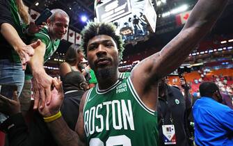 MIAMI, FL - MAY 19: Marcus Smart #36 of the Boston Celtics high-fives fans after Game 2 of the 2022 NBA Playoffs Eastern Conference Finals on May 19, 2022 at The FTX Arena in Miami, Florida. NOTE TO USER: User expressly acknowledges and agrees that, by downloading and/or using this Photograph, user is consenting to the terms and conditions of the Getty Images License Agreement. Mandatory Copyright Notice: Copyright 2022 NBAE (Photo by Jesse D. Garrabrant/NBAE via Getty Images) 