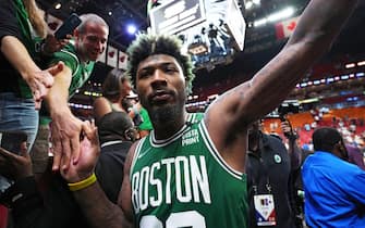 1240779643 MIAMI, FL - MAY 19: Marcus Smart #36 of the Boston Celtics high-fives fans after Game 2 of the 2022 NBA Playoffs Eastern Conference Finals on May 19, 2022 at The FTX Arena in Miami, Florida. NOTE TO USER: User expressly acknowledges and agrees that, by downloading and/or using this Photograph, user is consenting to the terms and conditions of the Getty Images License Agreement. Mandatory Copyright Notice: Copyright 2022 NBAE (Photo by Jesse D. Garrabrant/NBAE via Getty Images)