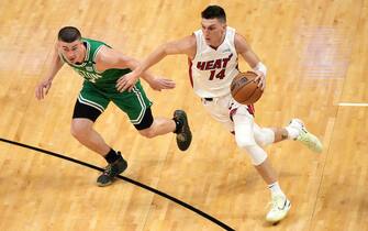 MIAMI, FLORIDA - MAY 19: Tyler Herro #14 of the Miami Heat drives to the basket against Payton Pritchard #11 of the Boston Celtics during the second quarter in Game Two of the 2022 NBA Playoffs Eastern Conference Finals at FTX Arena on May 19, 2022 in Miami, Florida. NOTE TO USER: User expressly acknowledges and agrees that, by downloading and or using this photograph, User is consenting to the terms and conditions of the Getty Images License Agreement. (Photo by Eric Espada/Getty Images)