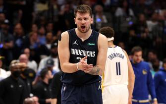 DALLAS, TEXAS - MAY 22: Luka Doncic #77 of the Dallas Mavericks reacts to a play during the fourth quarter against the Golden State Warriors in Game Three of the 2022 NBA Playoffs Western Conference Finals at American Airlines Center on May 22, 2022 in Dallas, Texas. NOTE TO USER: User expressly acknowledges and agrees that, by downloading and or using this photograph, User is consenting to the terms and conditions of the Getty Images License Agreement. (Photo by Tom Pennington/Getty Images)
