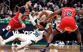 Boston - November 1: The Celtics Marcus Smart ends up on the floor as he and teammate Jayson Tatum battle with the Bulls Lonzo Ball and Ayo Dosunmu, as Celtics head coach Ime Udoka looks on at far right. The Boston Celtics hosted the Chicago Bulls in a regular season NBA basketball game at the TD Garden in Boston on Nov. 1, 2021. (Photo by Jim Davis/The Boston Globe via Getty Images)