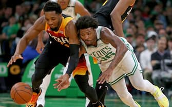 BOSTON, MA - March 23: Donovan Mitchell #45 of the Utah Jazz and Marcus Smart #36 of the Boston Celtics go after a loose ball during the first half of the NBA game at the TD Garden on March 23, 2022 in Boston, Massachusetts.  (Photo by Matt Stone/MediaNews Group/Boston Herald via Getty Images)