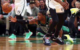 BOSTON, MASSACHUSETTS - APRIL 17: Marcus Smart #36 of the Boston Celtics dives for a loose ball during the first quarter of Round 1 Game 1 of the 2022 NBA Eastern Conference Playoffs against the Brooklyn Nets  at TD Garden on April 17, 2022 in Boston, Massachusetts. (Photo by Maddie Meyer/Getty Images)