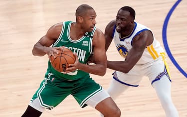 SAN FRANCISCO, CALIFORNIA - JUNE 02: Al Horford #42 of the Boston Celtics looks to pass the ball against Draymond Green #23 of the Golden State Warriors during the first quarter in Game One of the 2022 NBA Finals at Chase Center on June 02, 2022 in San Francisco, California. NOTE TO USER: User expressly acknowledges and agrees that, by downloading and/or using this photograph, User is consenting to the terms and conditions of the Getty Images License Agreement. (Photo by Thearon W. Henderson/Getty Images)