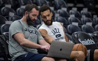 SALT LAKE CITY, UT -  DECEMBER 31: Rudy Gobert #27 of the Utah Jazz talks with coach Alex Jensen as they review film during warmup before their game against the Minnesota Timberwolves at the Vivint Smart Home Arena December 31, 2021 in Salt Lake City, Utah. NOTE TO USER: User expressly acknowledges and agrees that, by downloading and/or using this Photograph, user is consenting to the terms and conditions of the Getty Images License Agreement.(Photo by Chris Gardner/Getty Images)