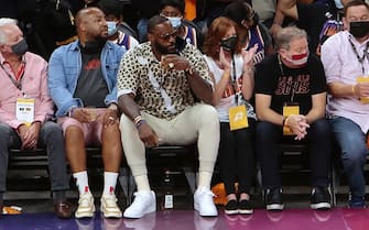 PHOENIX, AZ - JULY 17: LeBron James #23 of the Los Angeles Lakers attends the game between the Milwaukee Bucks and the Phoenix Suns during Game Five of the 2021 NBA Finals on July 17, 2021 at the Footprint Center in Phoenix, Arizona. NOTE TO USER: User expressly acknowledges and agrees that, by downloading and or using this photograph, User is consenting to the terms and conditions of the Getty Images License Agreement. Mandatory Copyright Notice: Copyright 2021 NBAE (Photo by Jim Poorten/NBAE via Getty Images)
