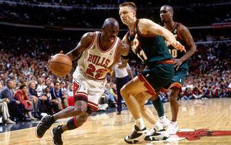 CHICAGO - JUNE 7:  Michael Jordan #23 of the Chicago Bulls drives to the basket against Detlef Schrempf #11 of the Seattle SuperSonics during Game Two of the 1996 NBA Finals at the United Center on June 7, 1996 in Chicago, Illinois.  The Bulls won 92-88.  NOTE TO USER: User expressly acknowledges that, by downloading and or using this photograph, User is consenting to the terms and conditions of the Getty Images License agreement. Mandatory Copyright Notice: Copyright 1996 NBAE (Photo by Andy Hayt/NBAE via Getty Images)