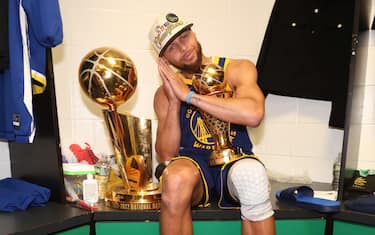 BOSTON, MA - JUNE 16: Stephen Curry #30 of the Golden State Warriors celebrates with the Bill Russell NBA Finals MVP Award after Game Six of the 2022 NBA Finals on June 16, 2022 at TD Garden in Boston, Massachusetts. NOTE TO USER: User expressly acknowledges and agrees that, by downloading and or using this photograph, user is consenting to the terms and conditions of Getty Images License Agreement. Mandatory Copyright Notice: Copyright 2022 NBAE (Photo by Nathaniel S. Butler/NBAE via Getty Images)
