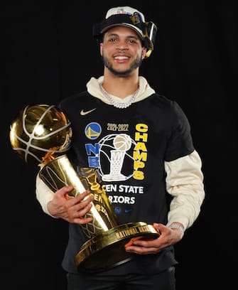 BOSTON, MA - JUNE 16: Quinndary Weatherspoon of the Golden State Warriors poses for a portrait with the Larry OBrien Trophy after winning Game Six of the 2022 NBA Finals against the Boston Celtics on June 16, 2022 at TD Garden in Boston, Massachusetts. NOTE TO USER: User expressly acknowledges and agrees that, by downloading and or using this photograph, user is consenting to the terms and conditions of Getty Images License Agreement. Mandatory Copyright Notice: Copyright 2022 NBAE (Photo by Jesse D. Garrabrant/NBAE via Getty Images)