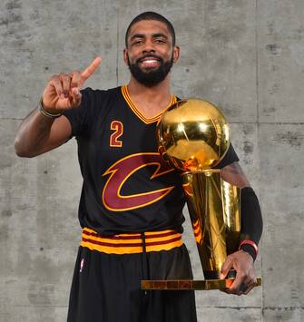 OAKLAND, CA - JUNE 19:  Kyrie Irving #2 of the Cleveland Cavaliers poses for a portrait after winning the NBA Championship against the Golden State Warriors during the 2016 NBA Finals Game Seven on June 19, 2016 at ORACLE Arena in Oakland, California. NOTE TO USER: User expressly acknowledges and agrees that, by downloading and or using this photograph, User is consenting to the terms and conditions of the Getty Images License Agreement. Mandatory Copyright Notice: Copyright 2016 NBAE (Photo by Jesse D. Garrabrant/NBAE via Getty Images)