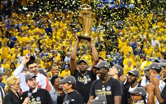 OAKLAND, CA - JUNE 12: Kevin Durant #35 of the Golden State Warriors holds up the trophy after winning the NBA Championship by defeating the Cleveland Cavaliers in Game Five of the 2017 NBA Finals on June 12, 2017 at ORACLE Arena in Oakland, California. NOTE TO USER: User expressly acknowledges and agrees that, by downloading and or using this photograph, user is consenting to the terms and conditions of Getty Images License Agreement. Mandatory Copyright Notice: Copyright 2017 NBAE (Photo by Jesse D. Garrabrant/NBAE via Getty Images)