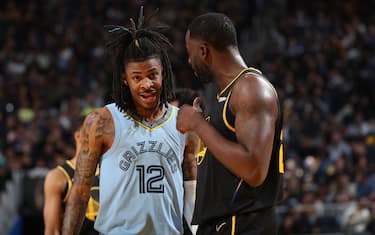SAN FRANCISCO, CA - MAY 7: Ja Morant #12 of the Memphis Grizzlies talks with Draymond Green #23 of the Golden State Warriors during Game 3 of the 2022 NBA Playoffs Western Conference Semifinals on May 7, 2022 at Chase Center in San Francisco, California. NOTE TO USER: User expressly acknowledges and agrees that, by downloading and or using this photograph, user is consenting to the terms and conditions of Getty Images License Agreement. Mandatory Copyright Notice: Copyright 2022 NBAE (Photo by Joe Murphy/NBAE via Getty Images)