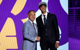 NEW YORK, NEW YORK - JUNE 23: Deputy commissioner Mark Tatum and Max Christie pose for photos after Christie was drafted 35th overall by the Los Angeles Lakers during the 2022 NBA Draft at Barclays Center on June 23, 2022 in New York City. NOTE TO USER: User expressly acknowledges and agrees that, by downloading and or using this photograph, User is consenting to the terms and conditions of the Getty Images License Agreement. (Photo by Sarah Stier/Getty Images)