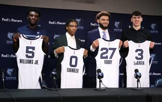 MEMPHIS, TN - June 24: Head Coach Taylor Jenkins, Vince Williams Jr., Kennedy Chandler, David Roddy, Jake LaRavia, and Zach Kleiman General Manager/Executive Vice President of Basketball Operation of the Memphis Grizzlies pose for a portrait during a 2022 NBA Press conference on June 24, 2022 at FedExForum in Memphis, Tennessee. NOTE TO USER: User expressly acknowledges and agrees that, by downloading and or using this photograph, User is consenting to the terms and conditions of the Getty Images License Agreement. Mandatory Copyright Notice: Copyright 2022 NBAE (Photo by Joe Murphy/NBAE via Getty Images)

