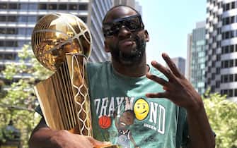 SAN FRANCISCO, CA - JUNE 20:  Draymond Green #23 of the Golden State Warriors poses for a photograph with the Larry O'Brien NBA Championship Trophy during their 2022 Victory Parade & Rally on June 20, 2022 at Chase Center in San Francisco, California. NOTE TO USER: User expressly acknowledges and agrees that, by downloading and or using this photograph, user is consenting to the terms and conditions of Getty Images License Agreement. Mandatory Copyright Notice: Copyright 2022 NBAE (Photo by Jim Poorten/NBAE via Getty Images)