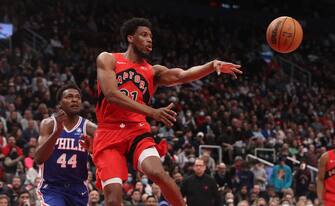 TORONTO, ON- APRIL 7  - Toronto Raptors forward Thaddeus Young (21) dishes off a pass in front of Philadelphia 76ers forward Paul Reed (44)  as the Toronto Raptors beat the Philadelphia 76ers 119-114 in Scotiabank Arena in Toronto. April 7, 2022.        (Steve Russell/Toronto Star via Getty Images)