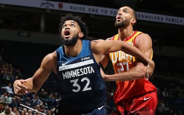 MINNEAPOLIS, MN - DECEMBER 11: Karl-Anthony Towns #32 of the Minnesota Timberwolves boxes out Rudy Gobert #27 of the Utah Jazz on December 11, 2019 at Target Center in Minneapolis, Minnesota. NOTE TO USER: User expressly acknowledges and agrees that, by downloading and or using this Photograph, user is consenting to the terms and conditions of the Getty Images License Agreement. Mandatory Copyright Notice: Copyright 2019 NBAE (Photo by David Sherman/NBAE via Getty Images)