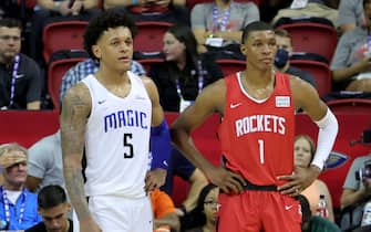 LAS VEGAS, NEVADA - JULY 07: Paolo Banchero #5 of the Orlando Magic and Jabari Smith Jr. #1 of the Houston Rockets stand on the court during a break in their game during the 2022 NBA Summer League at the Thomas & Mack Center on July 07, 2022 in Las Vegas, Nevada. NOTE TO USER: User expressly acknowledges and agrees that, by downloading and or using this photograph, User is consenting to the terms and conditions of the Getty Images License Agreement. (Photo by Ethan Miller/Getty Images)