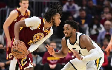 CLEVELAND, OHIO - DECEMBER 05: Donovan Mitchell #45 of the Utah Jazz guards Darius Garland #10 of the Cleveland Cavaliers d3q at Rocket Mortgage Fieldhouse on December 05, 2021 in Cleveland, Ohio. The Jazz defeated the Cavaliers 109-108. NOTE TO USER: User expressly acknowledges and agrees that, by downloading and/or using this photograph, user is consenting to the terms and conditions of the Getty Images License Agreement. (Photo by Jason Miller/Getty Images)