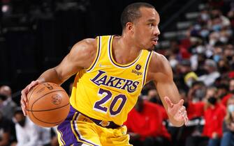 PORTLAND, OR - FEBRUARY 9: Avery Bradley #20 of the Los Angeles Lakers drives to the basket during the game against the Portland Trail Blazers  on February 9, 2022 at the Moda Center Arena in Portland, Oregon. NOTE TO USER: User expressly acknowledges and agrees that, by downloading and or using this photograph, user is consenting to the terms and conditions of the Getty Images License Agreement. Mandatory Copyright Notice: Copyright 2022 NBAE (Photo by Cameron Browne/NBAE via Getty Images)