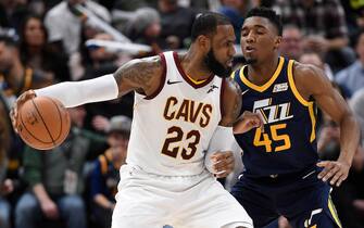 SALT LAKE CITY, UT - DECEMBER 30: LeBron James #23 of the Cleveland Cavaliers is defended by Donovan Mitchell #45 of the Utah Jazz in the second half of the 104-101 win by the Utah Jazz at Vivint Smart Home Arena on December 30, 2017 in Salt Lake City, Utah. NOTE TO USER: User expressly acknowledges and agrees that, by downloading and or using this photograph, User is consenting to the terms and conditions of the Getty Images License Agreement. (Photo by Gene Sweeney Jr./Getty Images)