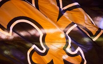 NASHVILLE, TN - AUGUST 26:  Flag with logo of the New Orleans Saints is run onto the field before a preseason game against the Pittsburgh Steelers at Mercedes-Benz Superdome on August 26, 2016 in New Orleans, Louisiana.  The Steelers defeated the Saints 27-14.  (Photo by Wesley Hitt/Getty Images)