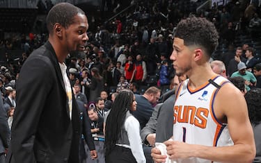 BROOKLYN, NY - FEBRUARY 3: Kevin Durant #7 of the Brooklyn Nets talks with Devin Booker #1 of the Phoenix Suns after the game on February 3, 2020 at Barclays Center in Brooklyn, New York. NOTE TO USER: User expressly acknowledges and agrees that, by downloading and or using this Photograph, user is consenting to the terms and conditions of the Getty Images License Agreement. Mandatory Copyright Notice: Copyright 2020 NBAE (Photo by Nathaniel S. Butler/NBAE via Getty Images)
