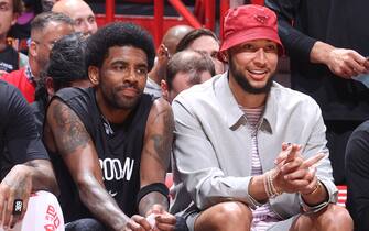 MIAMI, FL - MARCH 26: Kyrie Irving #11 of the Brooklyn Nets and Ben Simmons #10 of the Brooklyn Nets smile during the game against the Miami Heat on March 26, 2022 at FTX Arena in Miami, Florida. NOTE TO USER: User expressly acknowledges and agrees that, by downloading and or using this Photograph, user is consenting to the terms and conditions of the Getty Images License Agreement. Mandatory Copyright Notice: Copyright 2022 NBAE (Photo by Nathaniel S. Butler/NBAE via Getty Images)