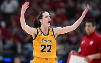 INDIANAPOLIS, IN - MARCH 6: Iowa guard Caitlin Clark (22) raises her arms in an effort to get the crowd cheering during the Women's Big Ten Tournament Championship college basketball game between the Indiana Hoosiers and the Iowa Hawkeyes on March 6, 2022 at Gainbridge Fieldhouse in Indianapolis, IN. (Photo by James Black/Icon Sportswire via Getty Images)