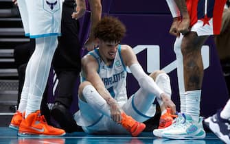 CHARLOTTE, NORTH CAROLINA - OCTOBER 10:  LaMelo Ball #1 of the Charlotte Hornets reacts after he is fouled and injured during the third quarter of the game against the Washington Wizards at Spectrum Center on October 10, 2022 in Charlotte, North Carolina. NOTE TO USER: User expressly acknowledges and agrees that, by downloading and or using this photograph, User is consenting to the terms and conditions of the Getty Images License Agreement. (Photo by Jared C. Tilton/Getty Images)