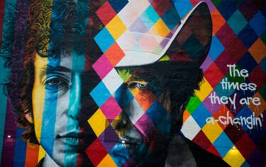 A mural of songwriter Bob Dylan by Brazilian artist Eduardo Kobra is on display in downtown Minneapolis, Minnesota on October 15, 2016. On October 13, 2016, Dylan was awarded the Nobel Prize in Literature. - Dylan is the second Nobel laureate in literature from Minnesota after Sinclair Lewis, whose biting satire of Midwestern life and the race to materialism won him the prize in 1930, a first by an American. Dylan's Nobel comes months after Minnesota's other musical luminary -- Prince, who proudly associated himself with the Minneapolis area -- died of an accidental painkiller overdose. (Photo by STEPHEN MATUREN / AFP) / TO GO WITH AFP STORY by Shaun TANDON, "For Dylan, aura of mystery extends to hometown"
RESTRICTED TO EDITORIAL USE - MANDATORY MENTION OF THE ARTIST UPON PUBLICATION - TO ILLUSTRATE THE EVENT AS SPECIFIED IN THE CAPTION (Photo by STEPHEN MATUREN/AFP via Getty Images)