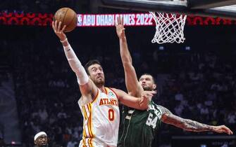 Milwaukee Bucks' forward Sandro Mamukelashvili (R) vies for the ball with Atlanta Hawks' forward Frank Kaminsky during the NBA pre-season basketball match between the Milwaukee Bucks and the Atlanta Hawks at the Etihad Arena on Yas Island in Abu Dhabi, on October 6, 2022. (Photo by Karim SAHIB / AFP) (Photo by KARIM SAHIB/AFP via Getty Images)