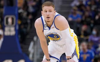 SAN FRANCISCO, CALIFORNIA - OCTOBER 14: Donte DiVincenzo #0 of the Golden State Warriors looks on against the Denver Nuggets during the first half of an NBA basketball game at Chase Center on October 14, 2022 in San Francisco, California. NOTE TO USER: User expressly acknowledges and agrees that, by downloading and or using this photograph, User is consenting to the terms and conditions of the Getty Images License Agreement. (Photo by Thearon W. Henderson/Getty Images)